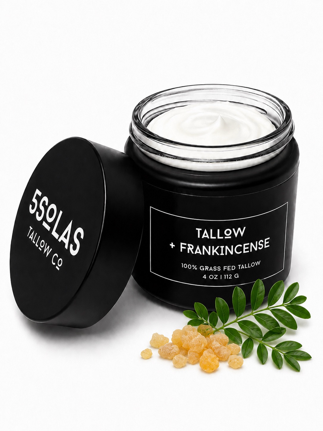 Open jar of 5Solas Tallow Co. grass‑fed tallow skin balm in the frankincense blend, shown with natural ingredients around the container.