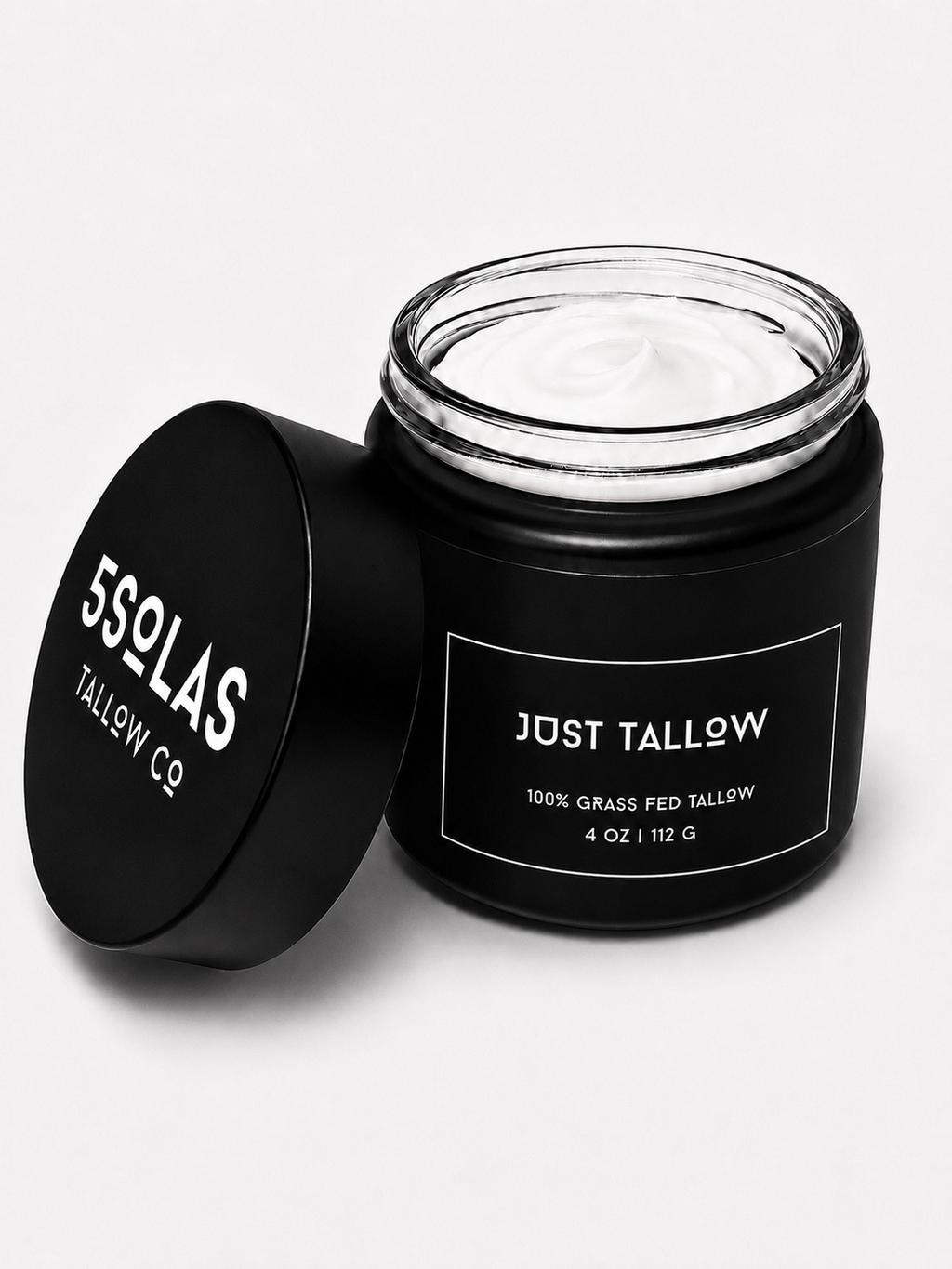 Open jar of 5Solas Tallow Co. grass‑fed tallow skin balm in the Just Tallow unscented blend, shown with its minimalist black container and lid.