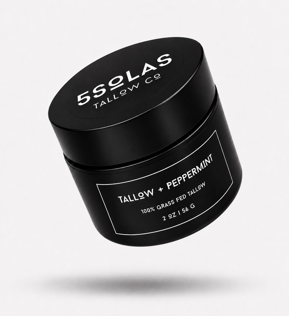 A black cylindrical cosmetic jar with a matching lid, floating at an angle on a light gray background. The lid and label are printed with white text reading '5SOLAS TALLOW CO' and 'TALLOW + PEPPERMINT'.