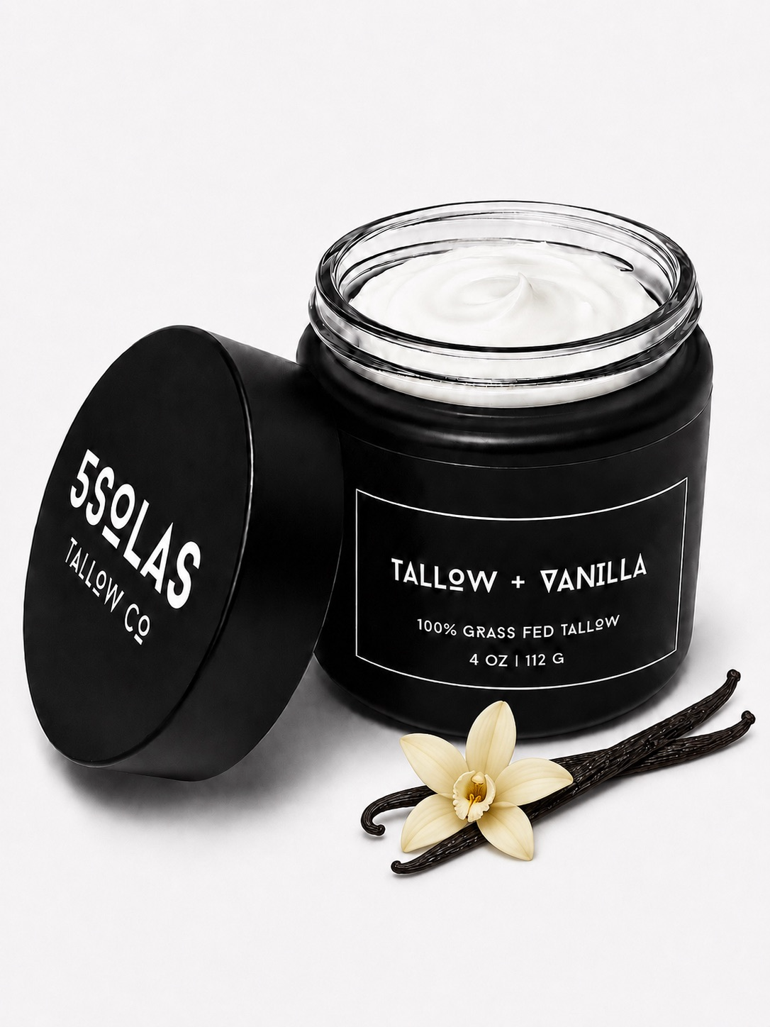 Open jar of 5Solas Tallow Co. grass‑fed tallow skin balm in the vanilla blend, shown with natural ingredients around the container.